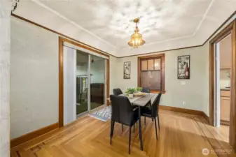 Coved ceilings throughout create the perfect ambiance in the dining room, off the sliding glass door leads out to the 3 finished sunrooms.