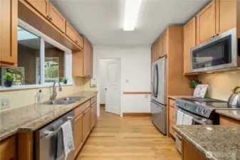 Updated kitchen w/SS appliances, granite countertops and window overlooking 3rd sunroom w/hot tub