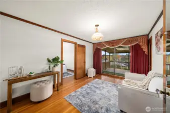 Upstairs 3rd bedroom w/walk in closet - theater room, playroom, sitting area? Sliding glass door opens to covered upper deck with Mt. Rainier view