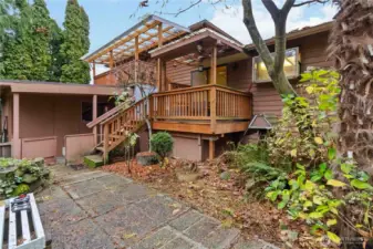 Charming courtyard with a covered deck- perfect for morning coffee or quiet evenings, and hosting gatherings