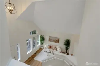 Soaring ceilings are the first thing you notice upon entering the home. This is a view from upstairs looking down over the formal living room.