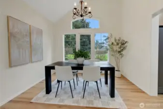 Formal dining room with beautiful windows that look out to the spacious backyard.