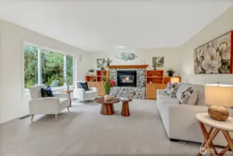 Family room off the kitchen is so inviting with its large windows for a ton of natural light that overlooks the back patio. Gas fireplace with bookshelves and mantle adds the perfect balance.