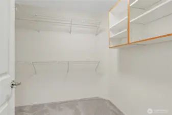 The walk-in closet off the primary suite the other closet is directly across from this one