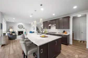 Large island features power outlets and is great for prepping and entertaining in style.