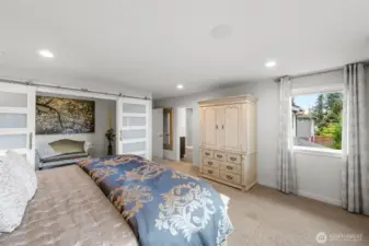 Primary bedroom also features an area staged as a sitting room but the possibilities are endless!