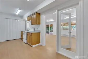 2nd kitchen & dining room open to 2nd family room w/access to full and lake views.