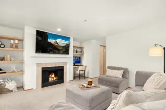 Spacious living area with powder room off the hall.