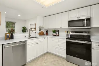 Kitchen overlooks the formal dining area.