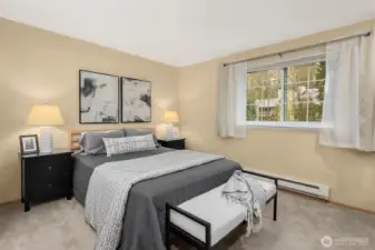 Spacious primary bedroom, with room for a king bed and two nightstands.