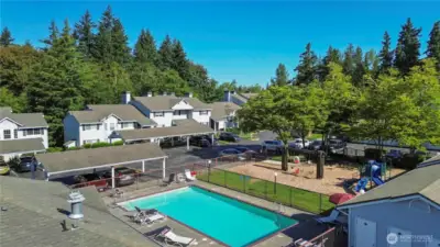 Overview of the pool and playground during the Summer.