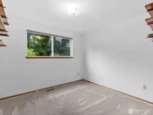 The 1st of 3 bedrooms on the main floor.