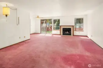 Living Room with Slider to Fenced Backyard & Patio