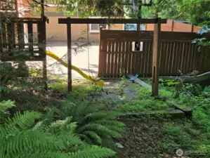 this is on neighbors property and does not go with the sale.