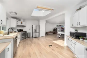 Kitchen opens up the family room and dining room