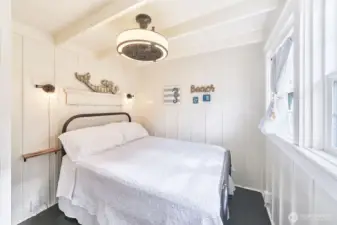 Cozy bedroom with painted fir floors