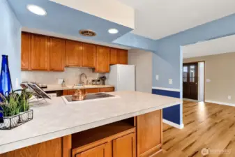 Kitchen with breakfast bar and storage under the counter.