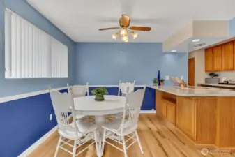 Dining room with ceiling fan.