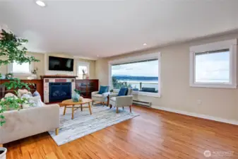 Living room with propane insert fireplace to the left.