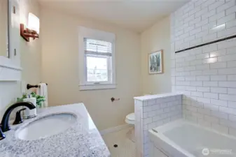 Bathroom off second bedroom.  Jetted tub with shower.