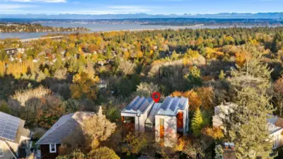 Expansive views of Portage Bay, Lake Washington, Mt Baker, Cascades and downtown Bellevue