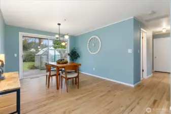 A spacious dining room with access to the back yard.