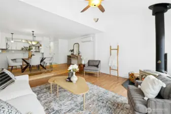 Living area with vaulted ceilings and ceiling fan.