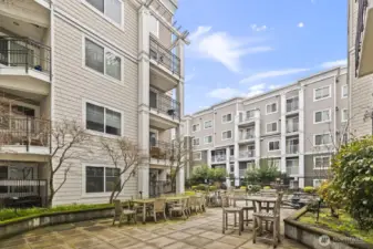 The huge center patio/courtyard area sits up above the street to create a quiet outdoor space great for relaxing with friends, BBQs, and remote work.