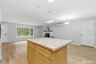 Kitchen island open to living room and dining room