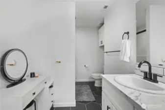 Primary ensuite full bath, love the makeup table on the left!