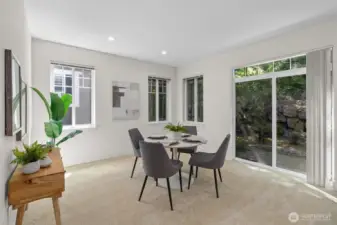 Dining area with direct access to the backyard space **Staged**