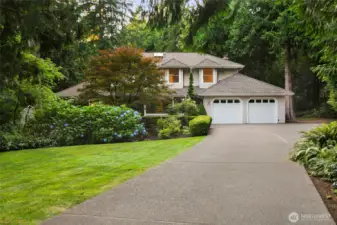 Grand front entry w/mature landscaping