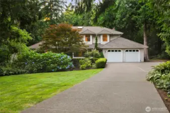 Grand front entry w/mature landscaping