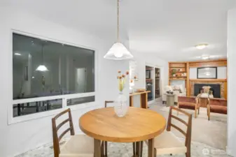 Casual dining area & den w/ backyard access