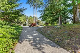 Entering this property feels like you are driving into a circular driveway of an estate.