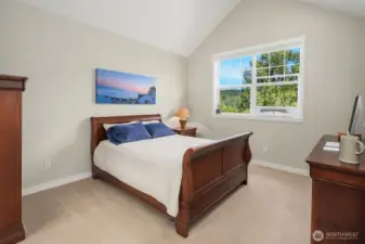 Primary suite with tall vaulted ceilings