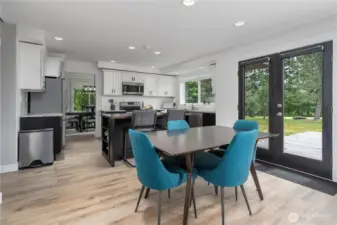 Huge kitchen with bar seating and eating area. Pantry around the corner.