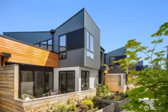 Charming planter boxes welcome you, offering an opportunity to cultivate your own garden oasis.