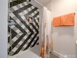 Walk in shower wtih Statements custom tile. Heated floors for your comfort. Grohe and Toto fixtures.