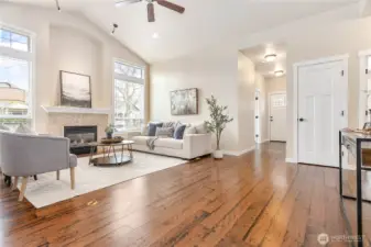 Nice open feel throughout living space. Coat closet through door ahead