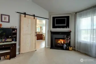 Primary with fireplace and brand new barn door