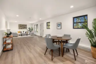 Luxury vinyl flooring smartly installed to make this level ready for a variety of uses. The far wall has an outlet/wiring for a flat screen tv.