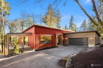 The attached two car garage is wired with 220V and car-charger ready.