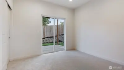 Bedroom with access to fully fenced backyard