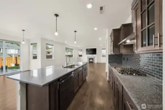 Gas cooktop, full height tile backsplash