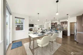 Virtually staged dining, kitchen, great room