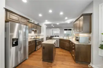 BOTH the island and the peninsula present electrical outlets for your appliance convenience. (You can NOT that in new construction!!!). Brand new refrigerator - too COOL! Like November NEW!