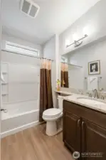 Full bath with transom window for natural light and here's a secret (materials used in this home are virtually exactly like those of some new construction in the area). But, these homes are finished with landscaping and other updates. Compare for yourself and you'll be sure to LOVE Trilogy - especially this home!