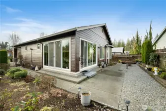FOUR panels of sliding glass doors / glass on TWO sides of this well-built improvement to the home. Buyers and builders did a fabulous job. This biophilic space is a PERFECT adaptation to living in Trilogy at Tehaleh where life is better in the neighborwoods.