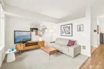 A comfortable living room has a sense of airiness for a nice open feel.